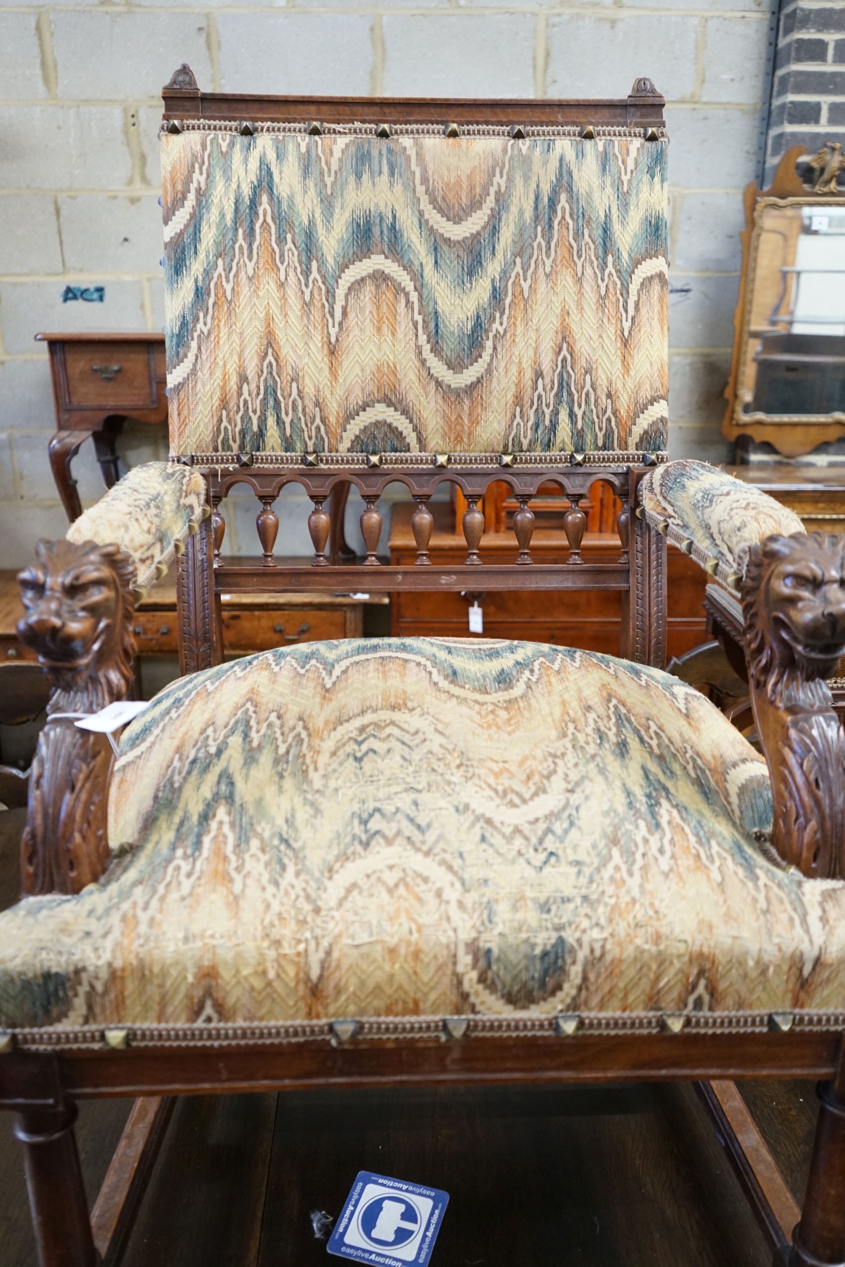 An early 20th century French walnut elbow chair with carved lion head arms, width 63cm, depth 60cm, height 106cm